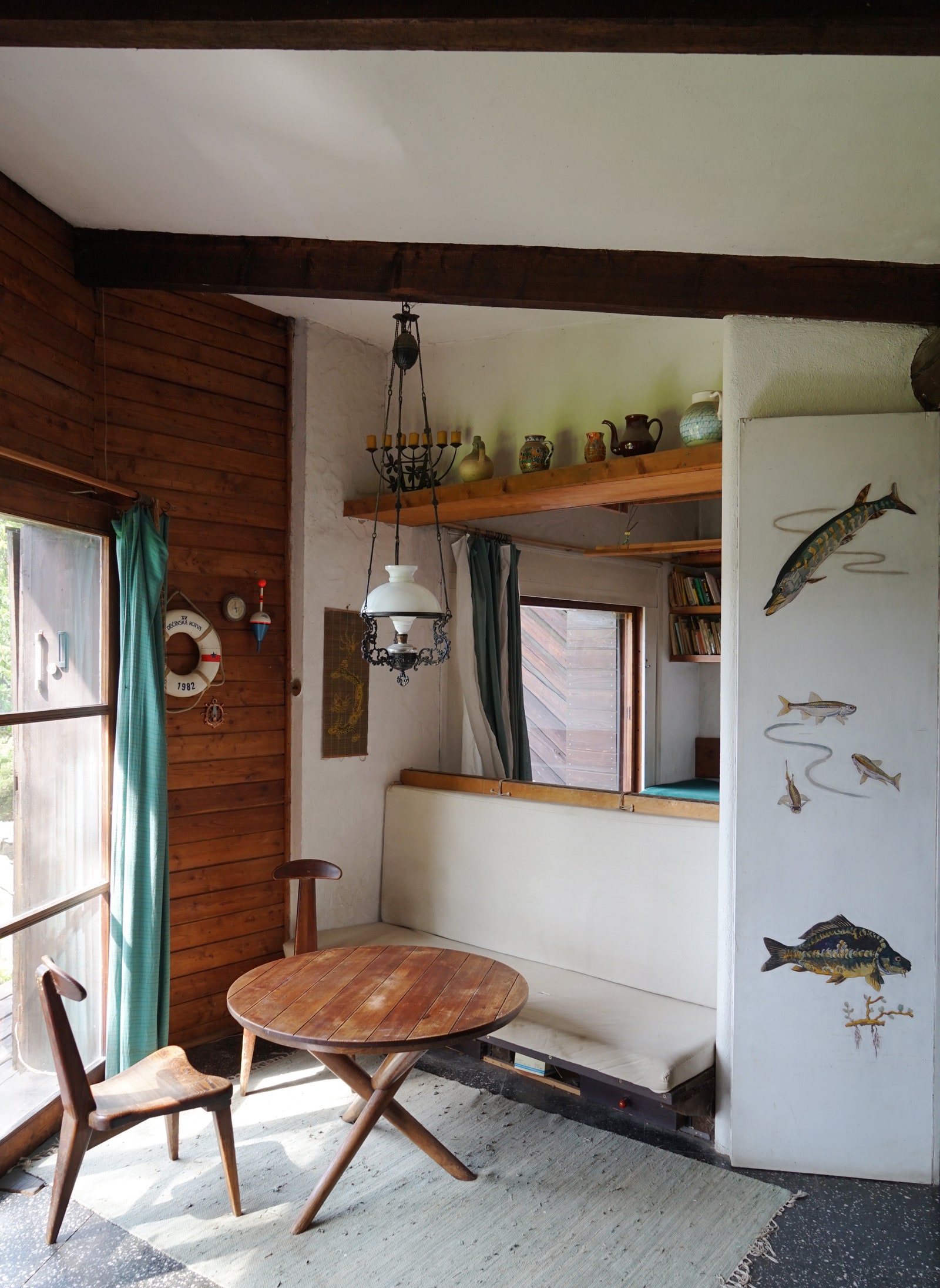 Image may contain Indoors Interior Design Wood Chair Furniture Plywood Animal Fish Sea Life and Hardwood