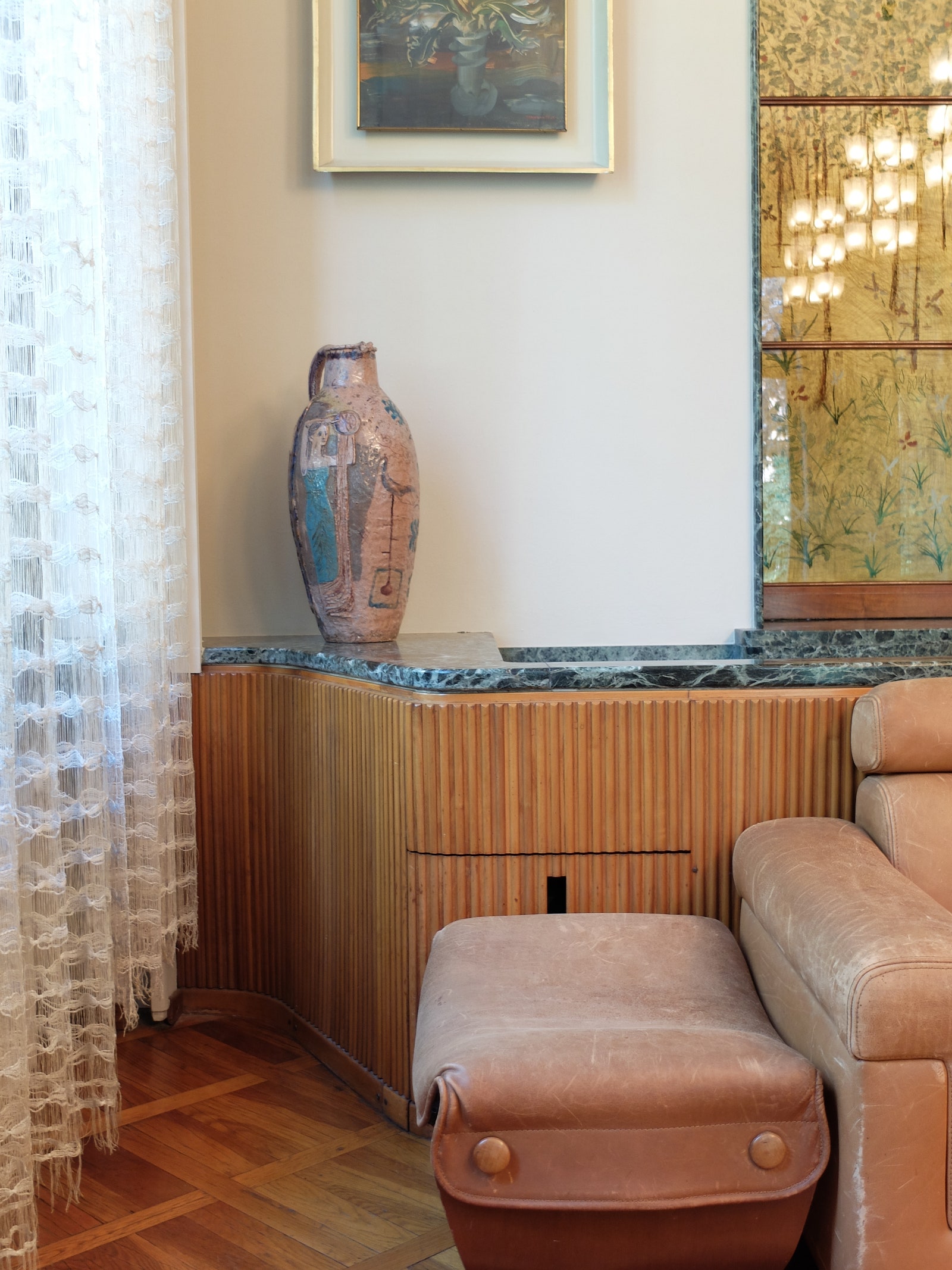 The builtin sideboard by Osvaldo Borsani in the living room creates a tambourlike effect. The designers father was the...